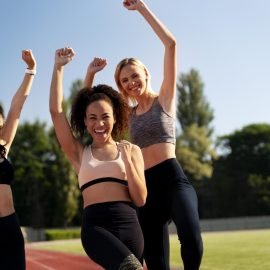 front-view-female-runners-being-victorious